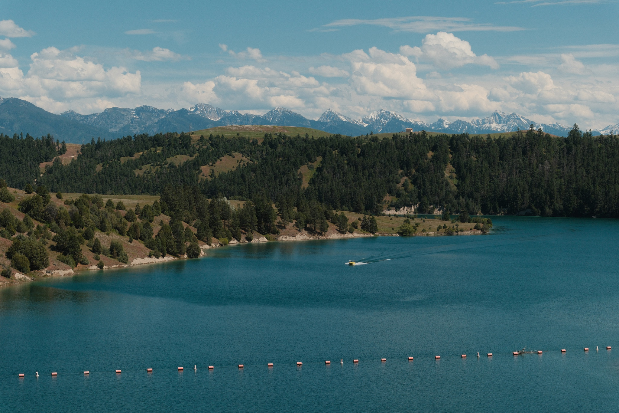 A boat sailing across the lake